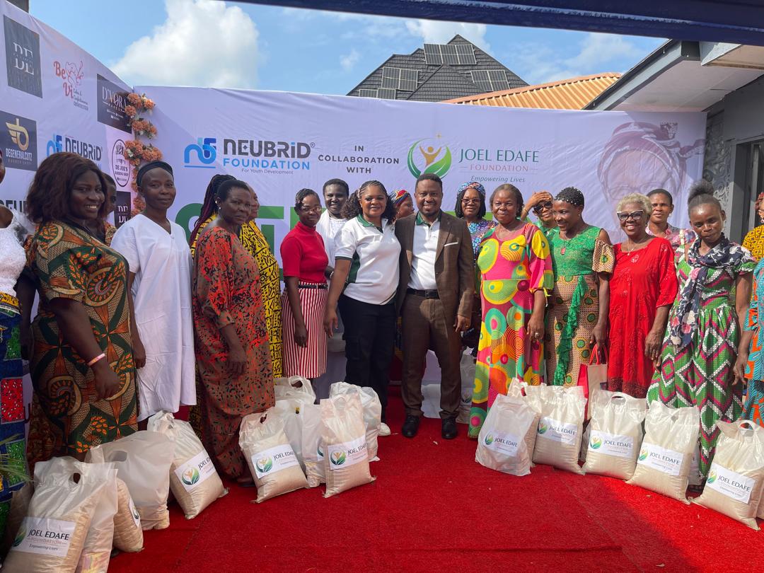 Joel Edafe Foundation outreach team with community members and food-support packages
